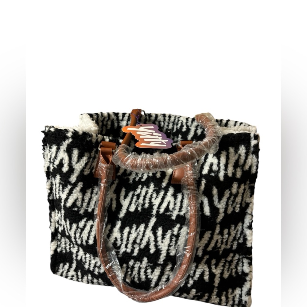 Stylish Black and White Tote with Tan Handles